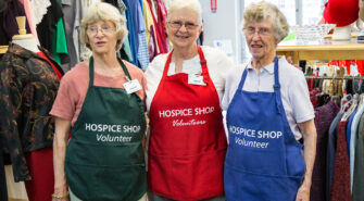 Three RSVP volunteers in the Hospice Shop