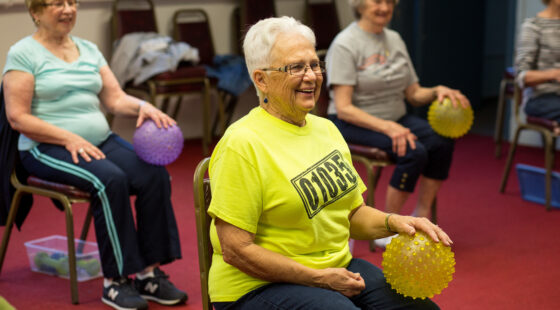 An HBB volunteer leads an exercise class