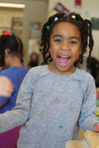 Preschool girl smiling at the camera